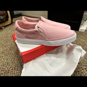 Pink Nike slide ons